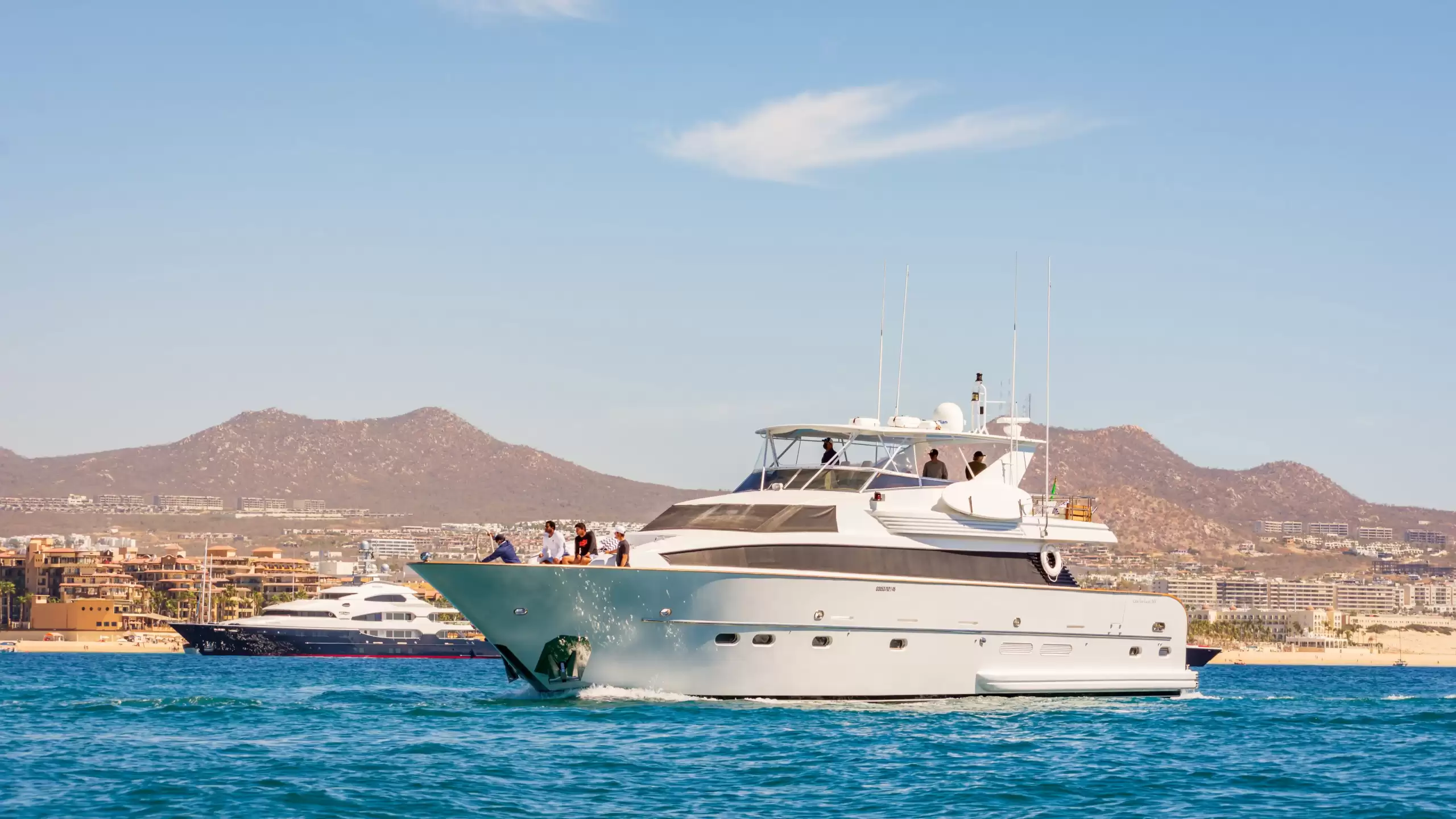 Superyacht charter in Los Cabos docked along the Cabo San Lucas waterfront, highlighting private yacht experiences on the Baja California coast.